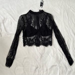 2 lace tops. Black and burgundy. Black has tags still on. Burgundy worn once.